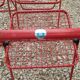 Set of 5 vintage red metal mesh folding chairs, Ted Net style.