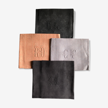 Set of four old damasked and monogrammed towels, tinted multiple colors