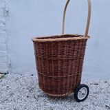 Vintage wicker log basket on vintage wheels
