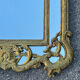 Large mirror with carved and gilded wooden frame, in Regency style.