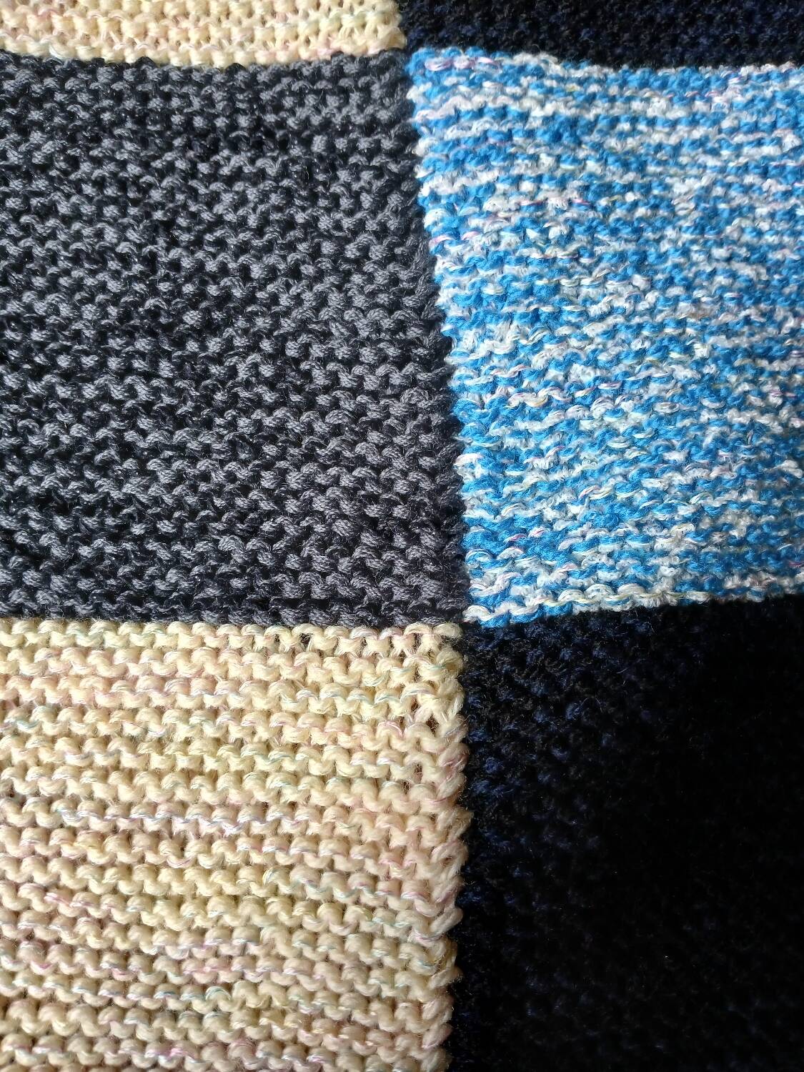 Hand knitted patchwork plaid