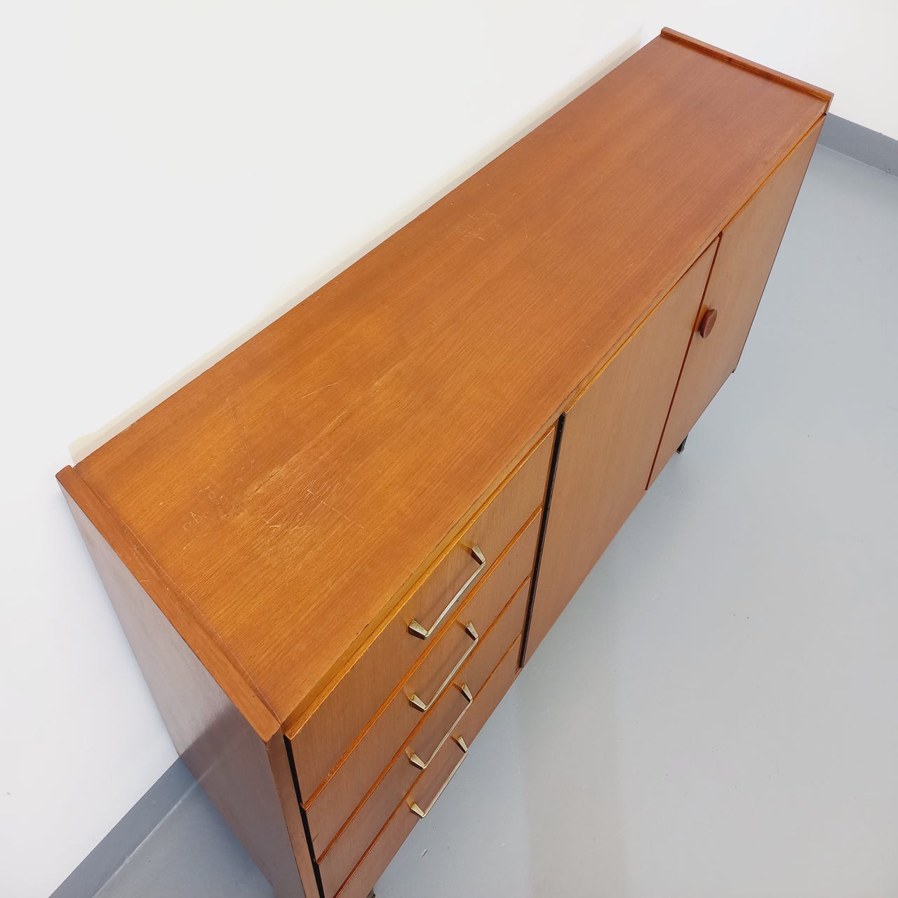 Vintage teak and black metal row from the 60s