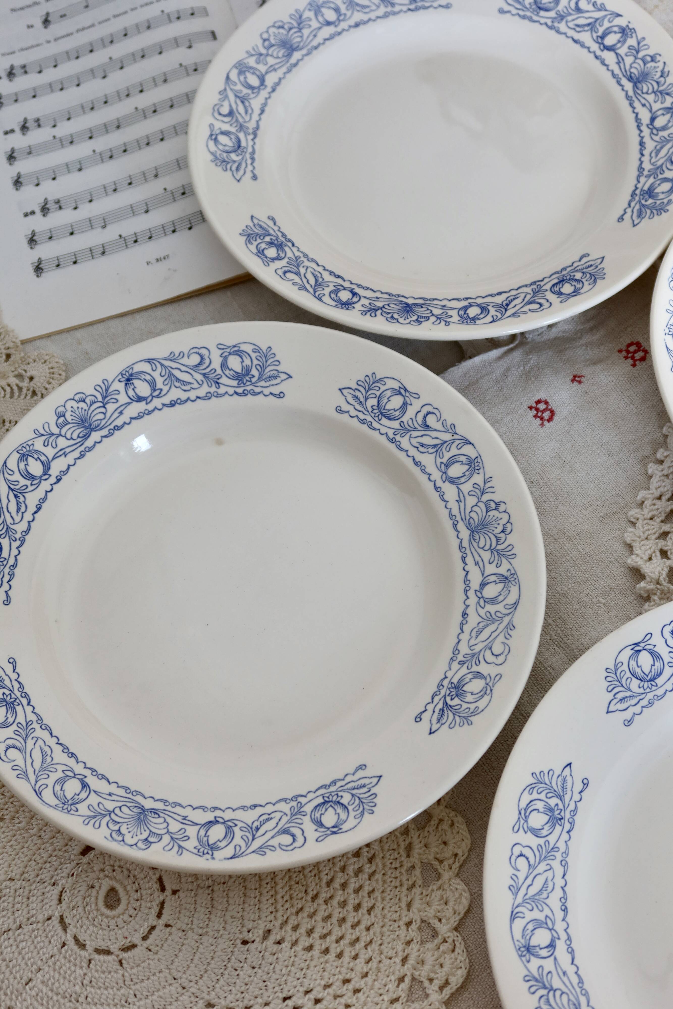 4 vintage white soup plates with blue border