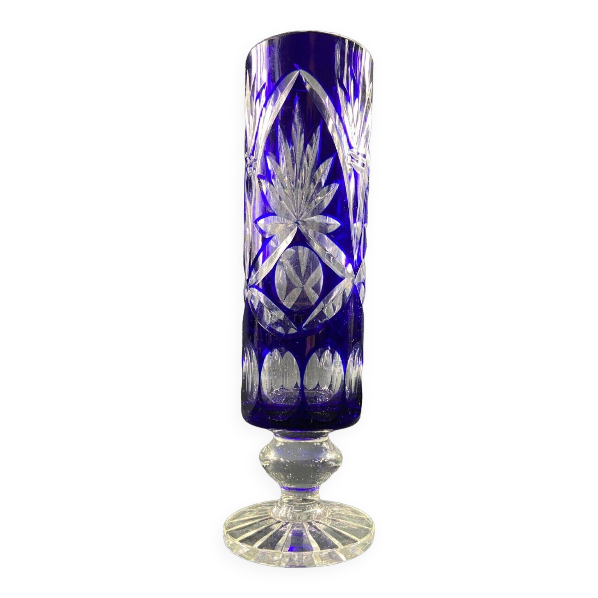 Tubular vase on a pedestal in cut blue Bohemian crystal.