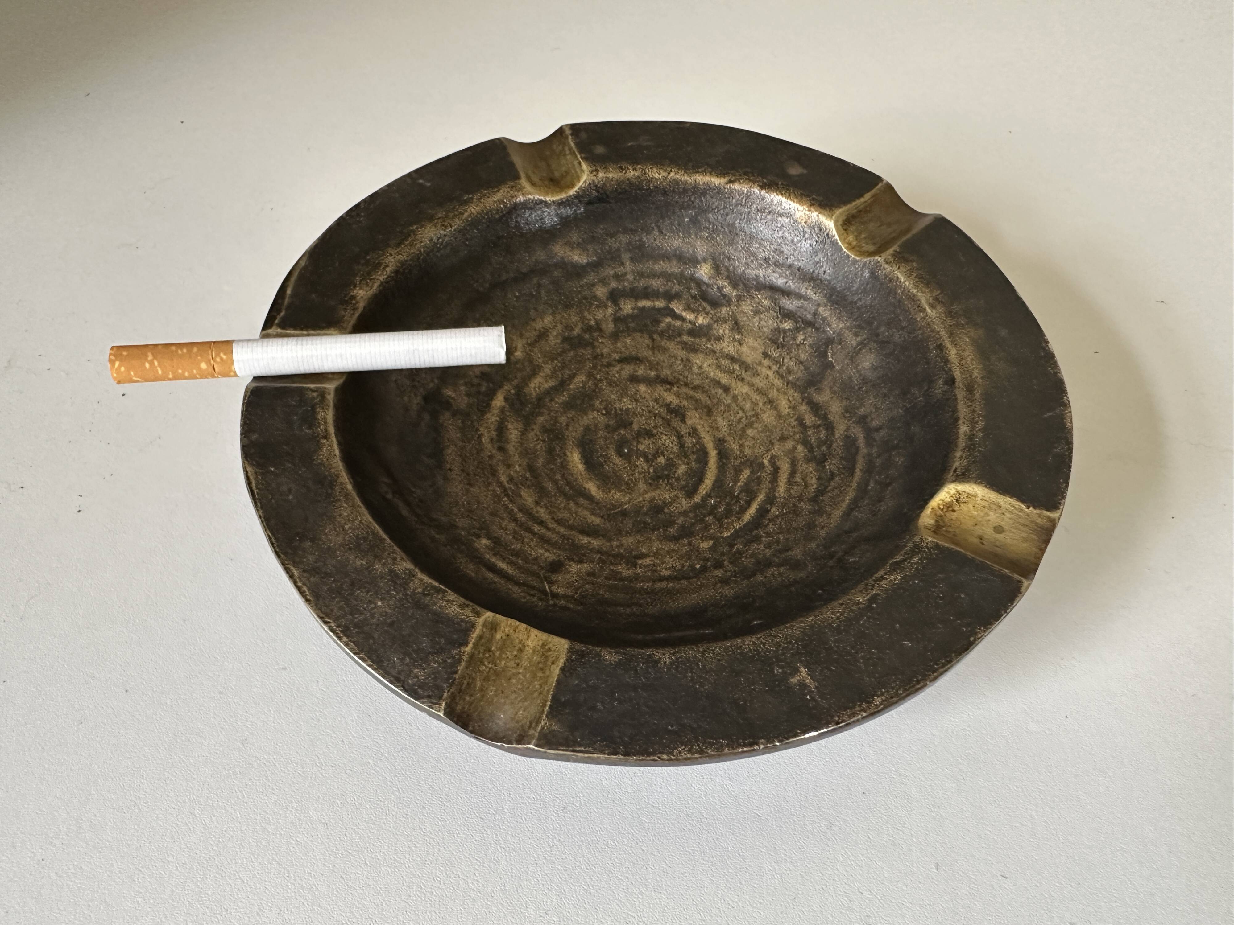 Vintage bronze ashtray design from the 60s