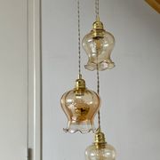 Triple vintage tulip pendant light in amber glass