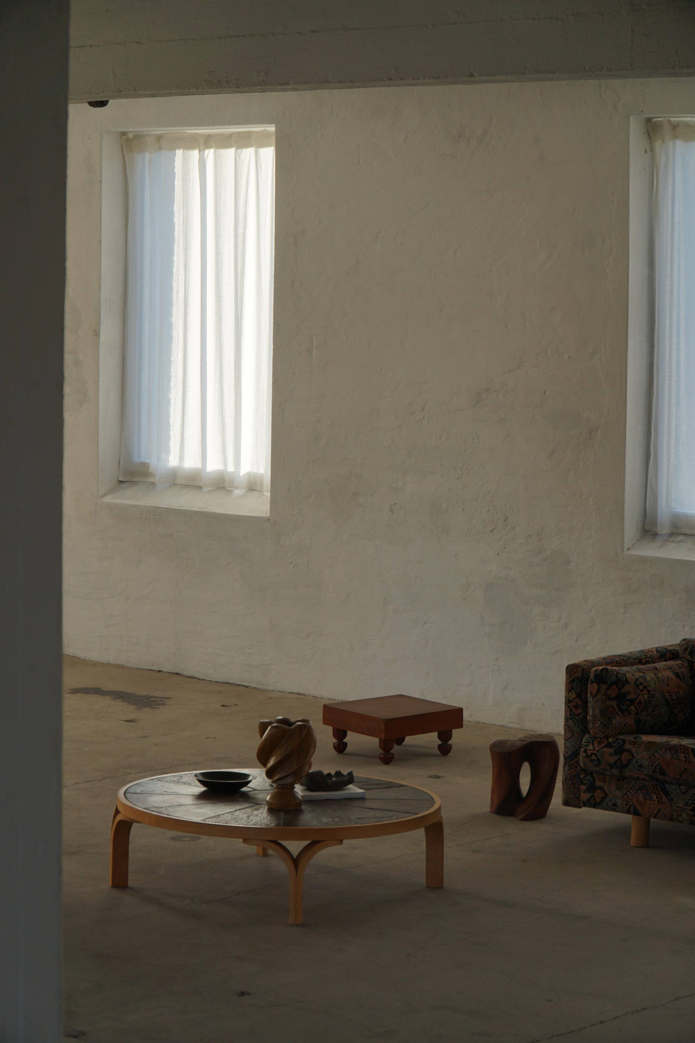 Danish coffee table from the mid-20th century, wooden frame and ceramic tiled top.