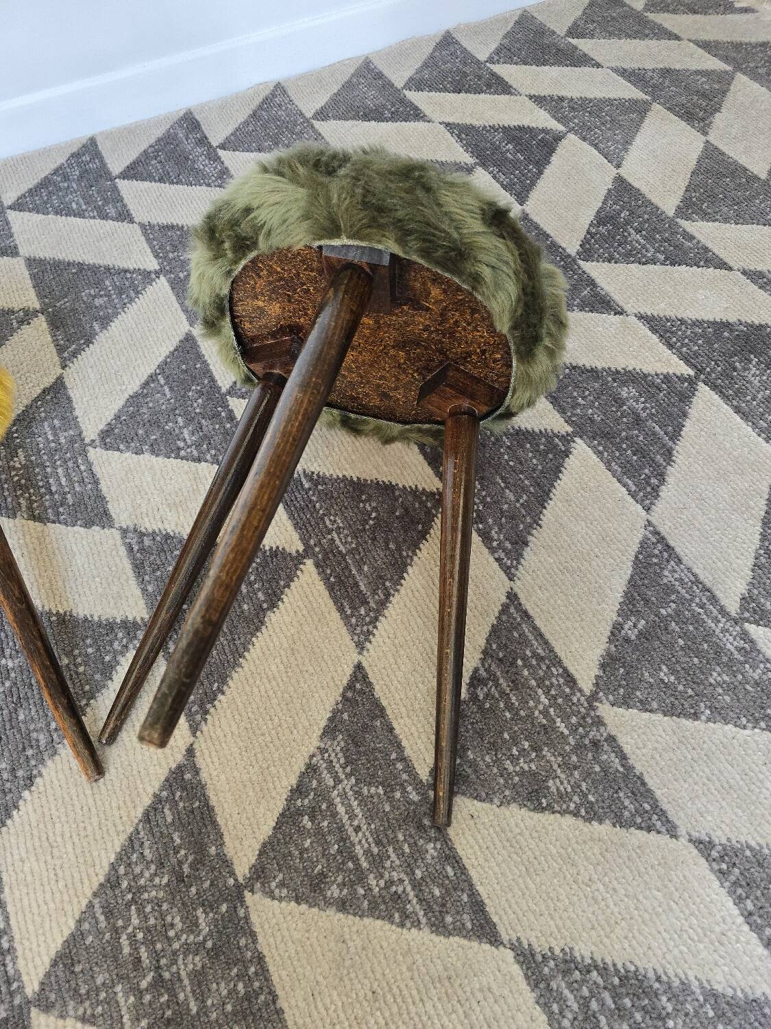 Green wooden tripod stool