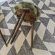 Green wooden tripod stool