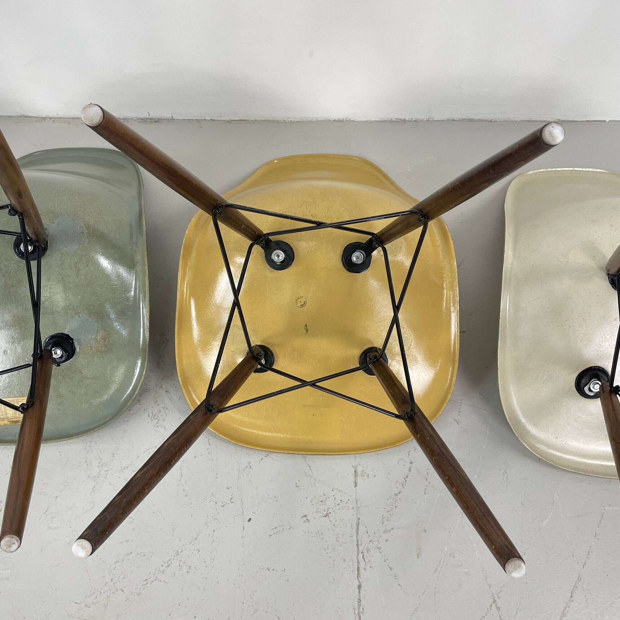 Eames Herman Miller DSW side chairs in greige, seafoam green, light ochre and parchment with slight