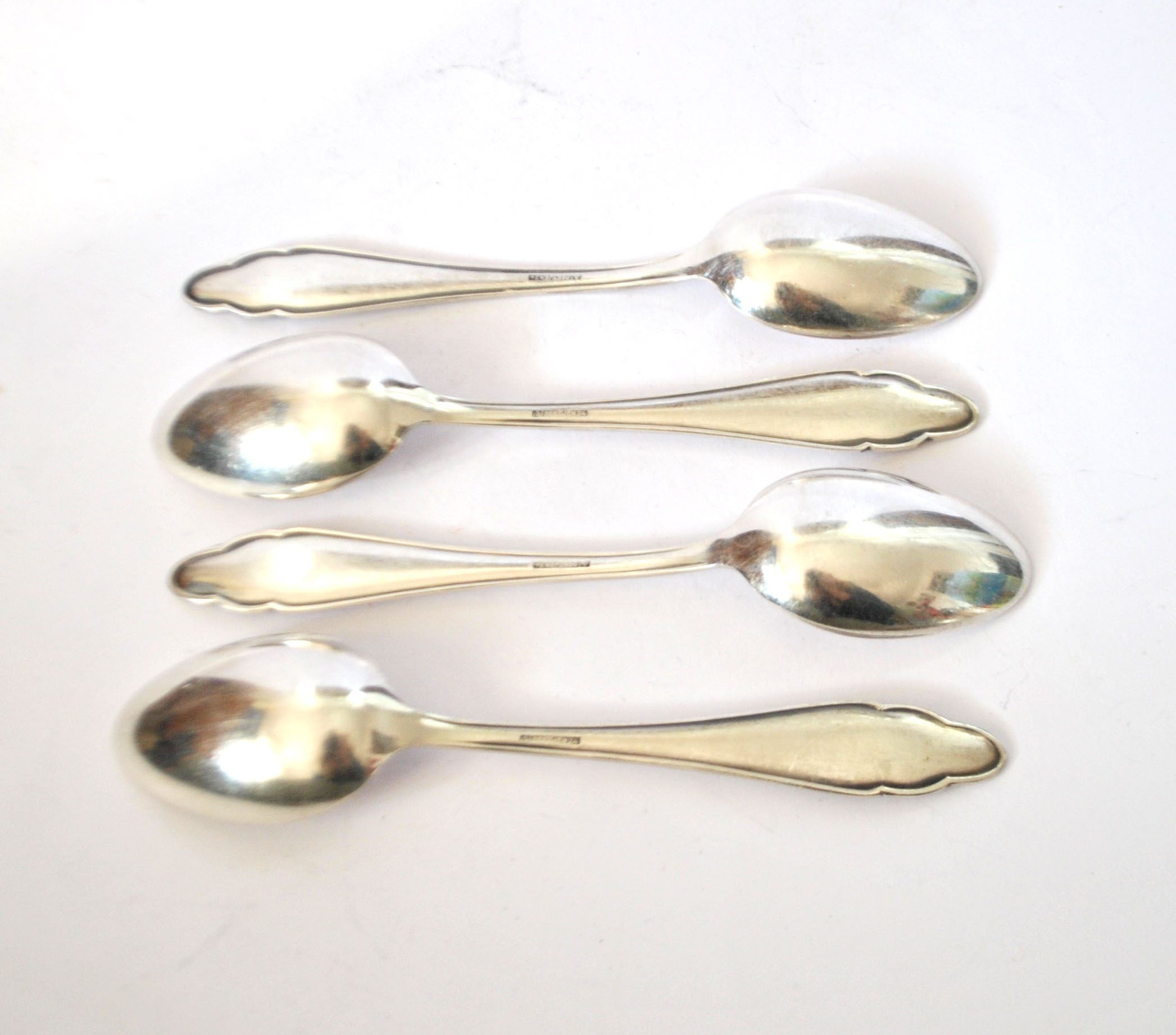 DEETJEN set of 4 silver-plated dessert spoons with a modernist scalloped design.