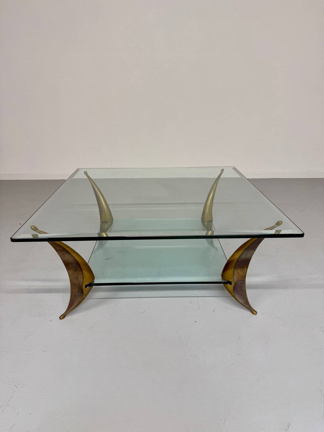 Glass coffee table with solid brass legs, Italian design from the 60s