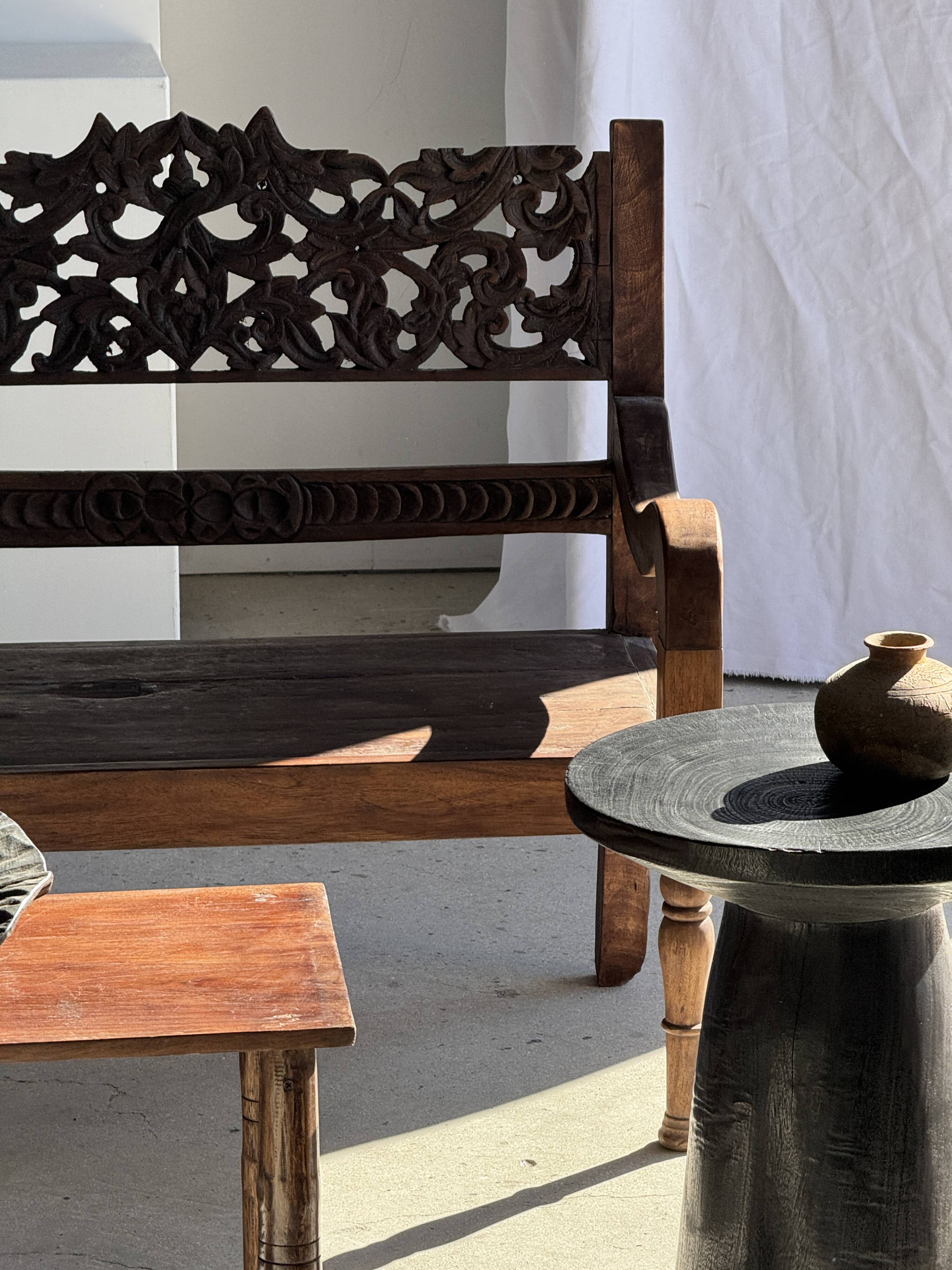 Black solid mango side table (monoxyle) with conical legs