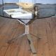 Round coffee table in smoked glass and chrome