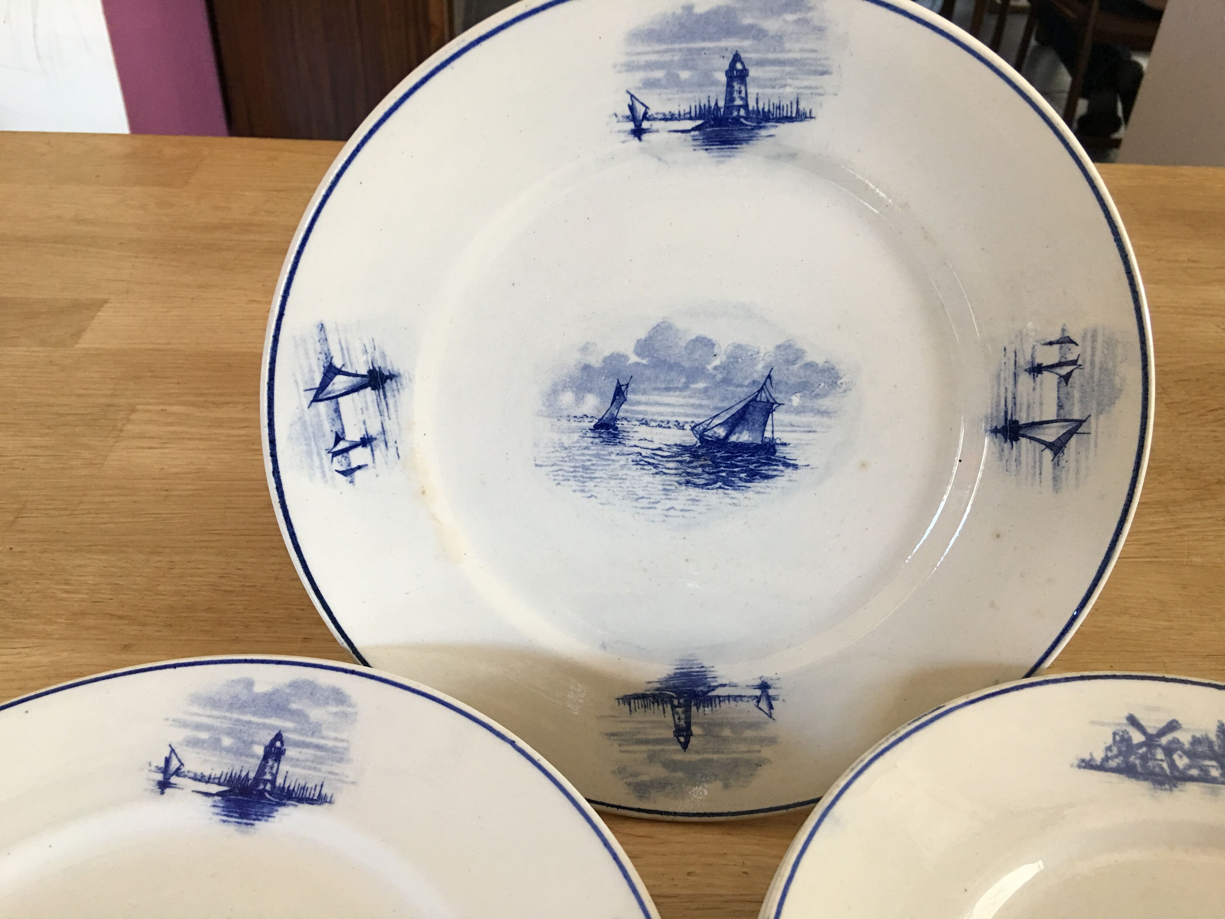 Series of 11 flat plates, Dutch earthenware, early XX