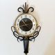 Jaz clock in black metal and golden brass, model Cabic 1967/1968