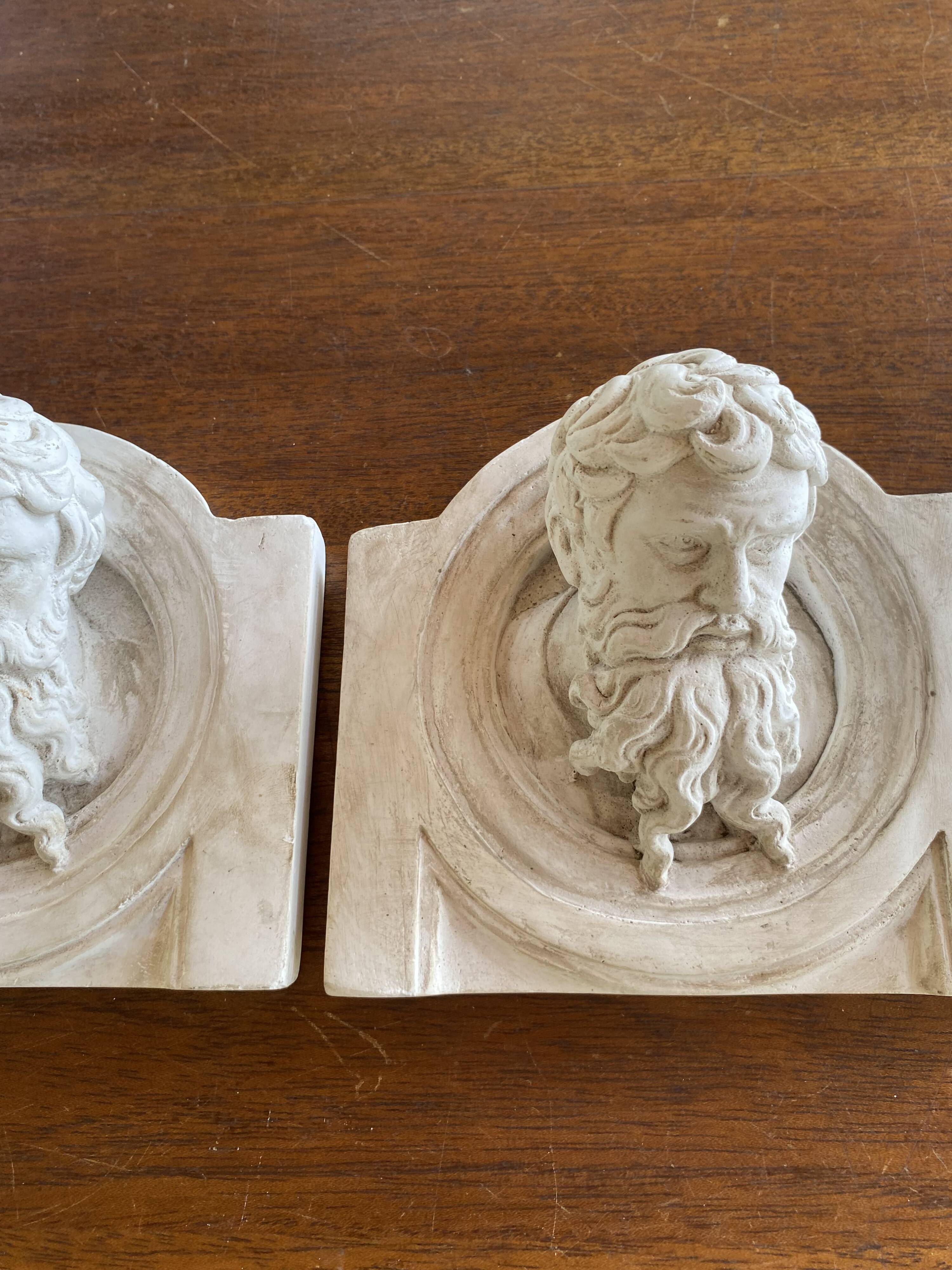 Two moulds; plaster heads