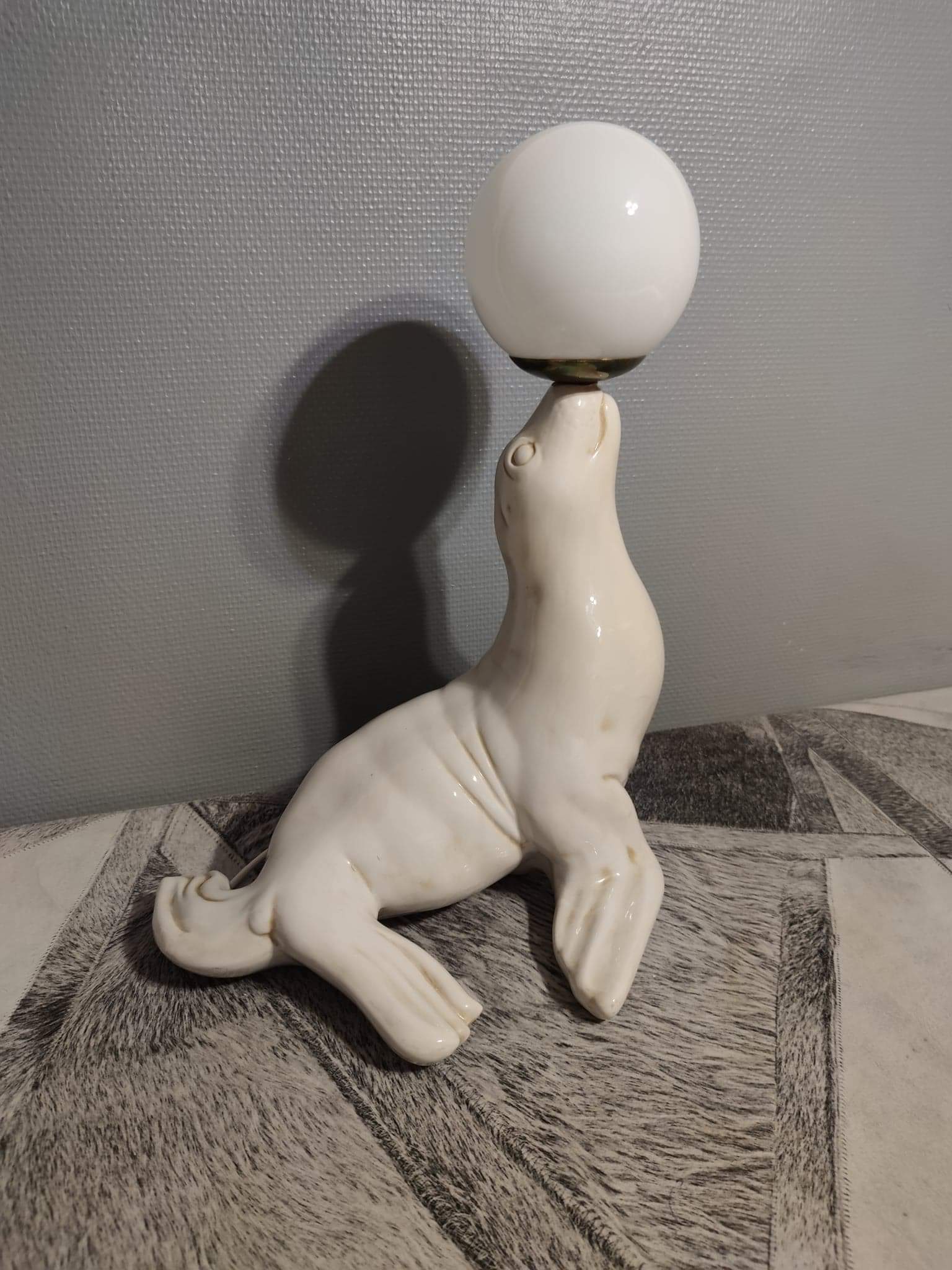 White ceramic sea lion lamp and opaline globe