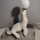 White ceramic sea lion lamp and opaline globe