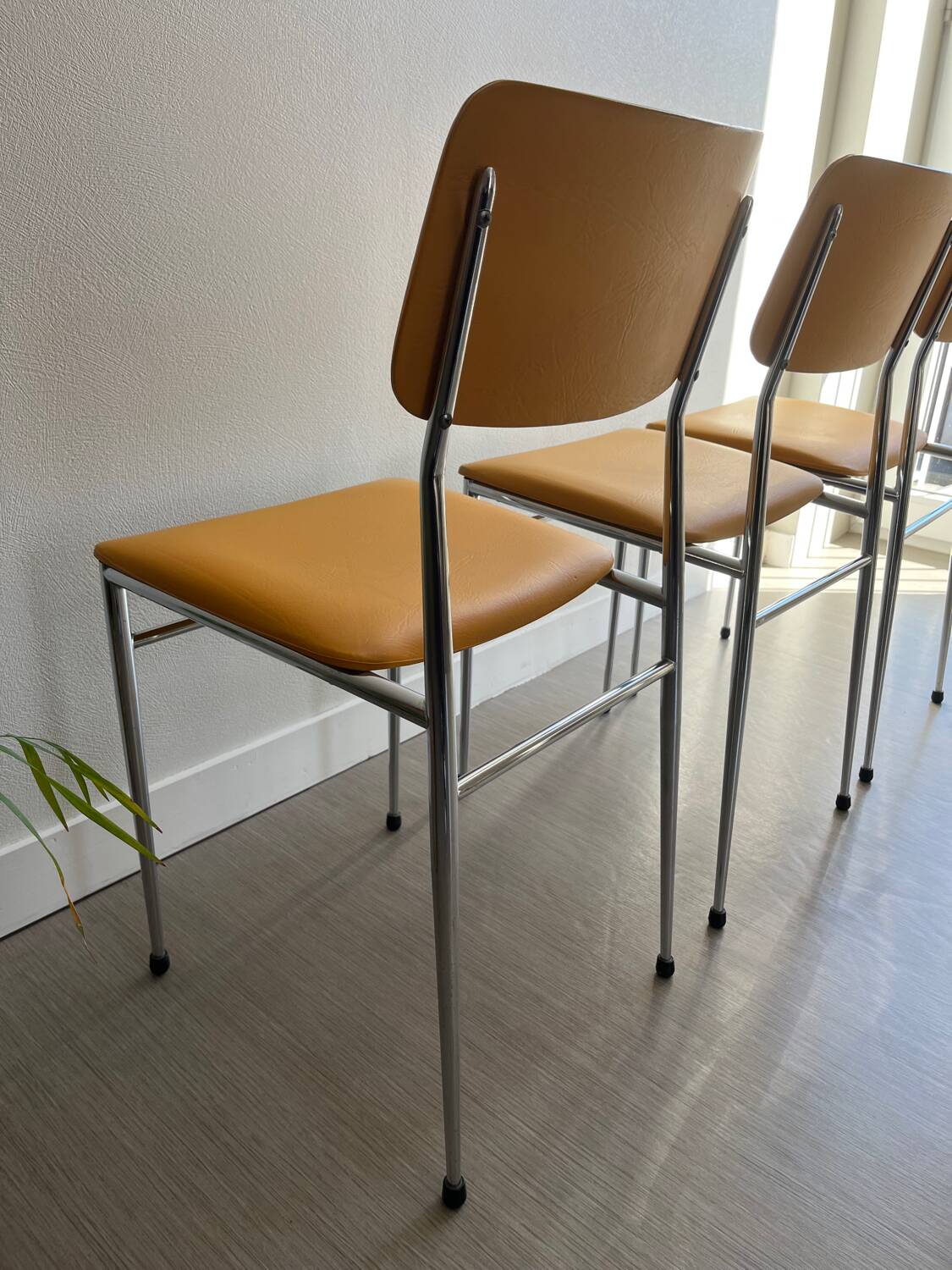 LM vintage chrome and orange/mustard yellow faux leather chairs