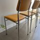 LM vintage chrome and orange/mustard yellow faux leather chairs