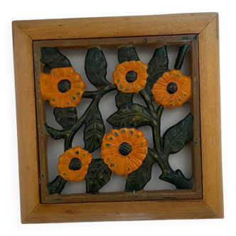 Enamelled iron trivet with wooden frame