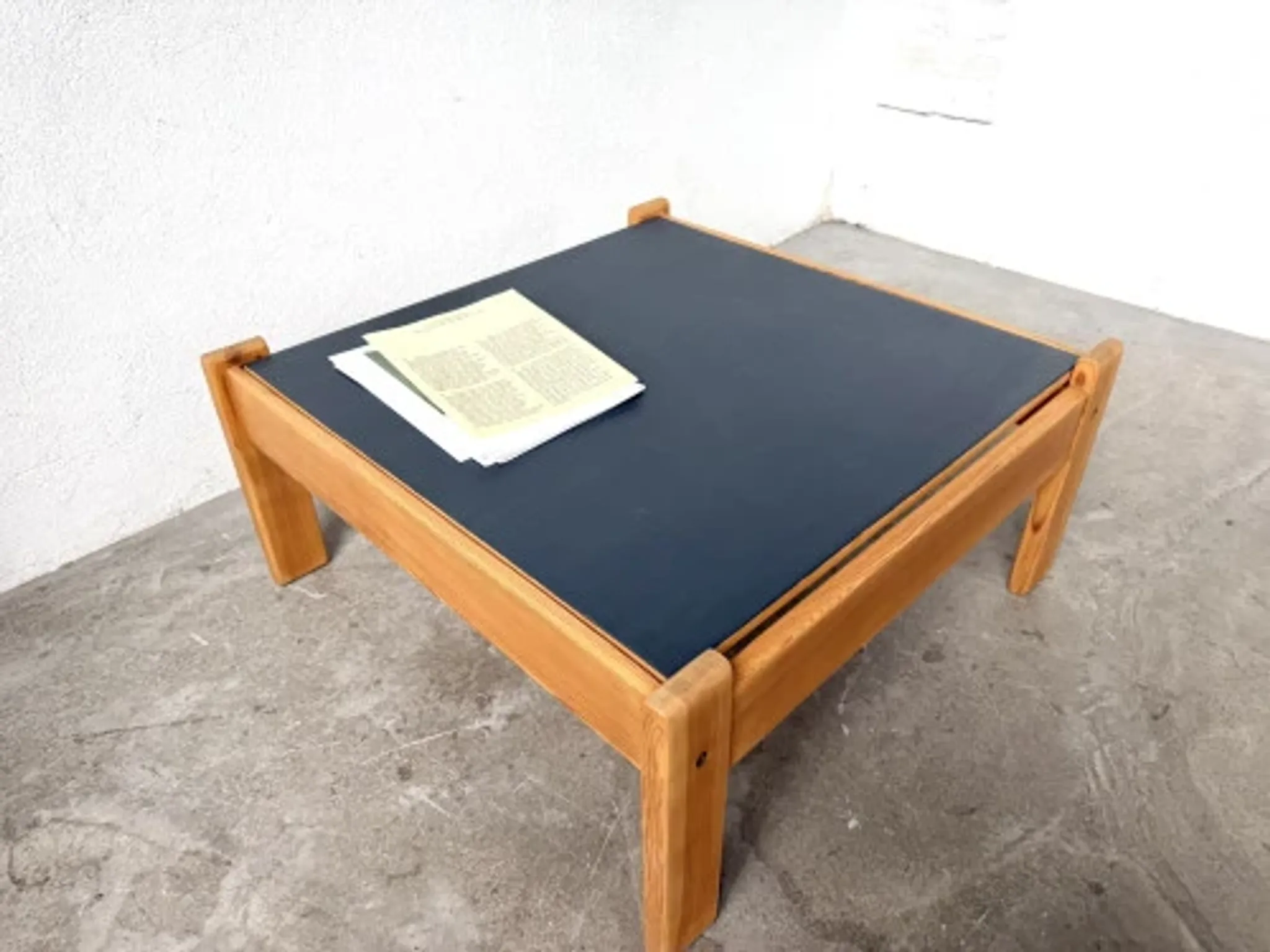 Modernist coffee table in solid pine with a reversible top, 1970s.