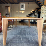 Dining table ligne roset model trapèze in solid walnut with oil finish.
