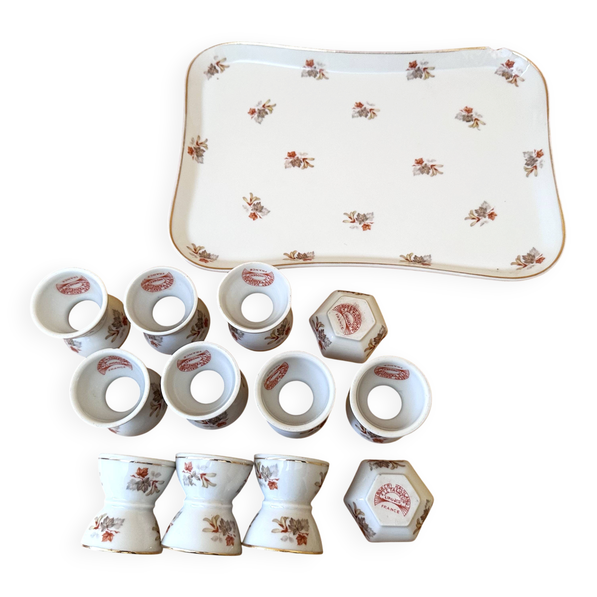 10 devil's egg cups and 2 porcelain salt cellars by Haviland and Le Tanneur 1920