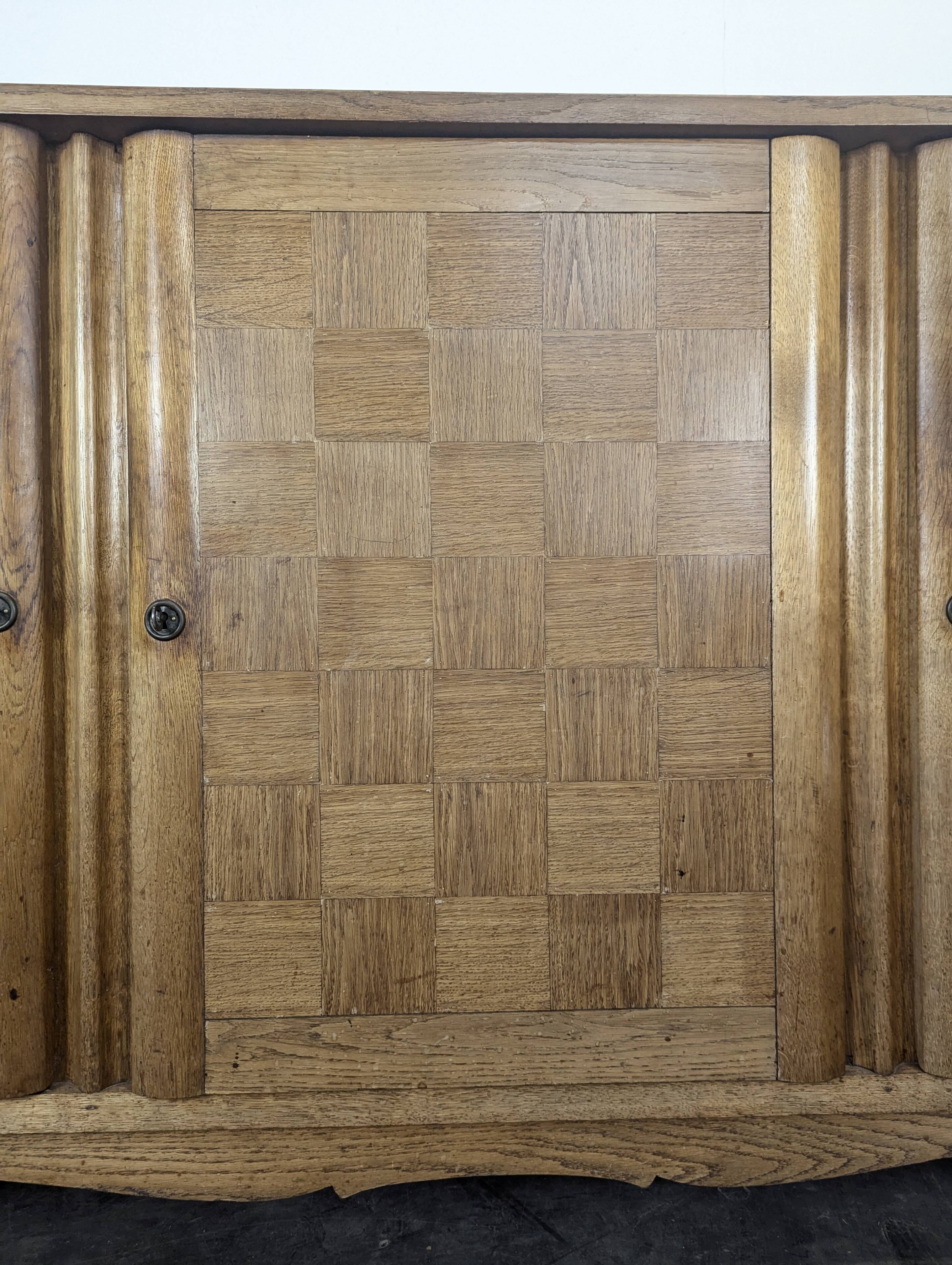 Art Deco oak enfilade with checkerboard marquetry, three doors, 1940s.