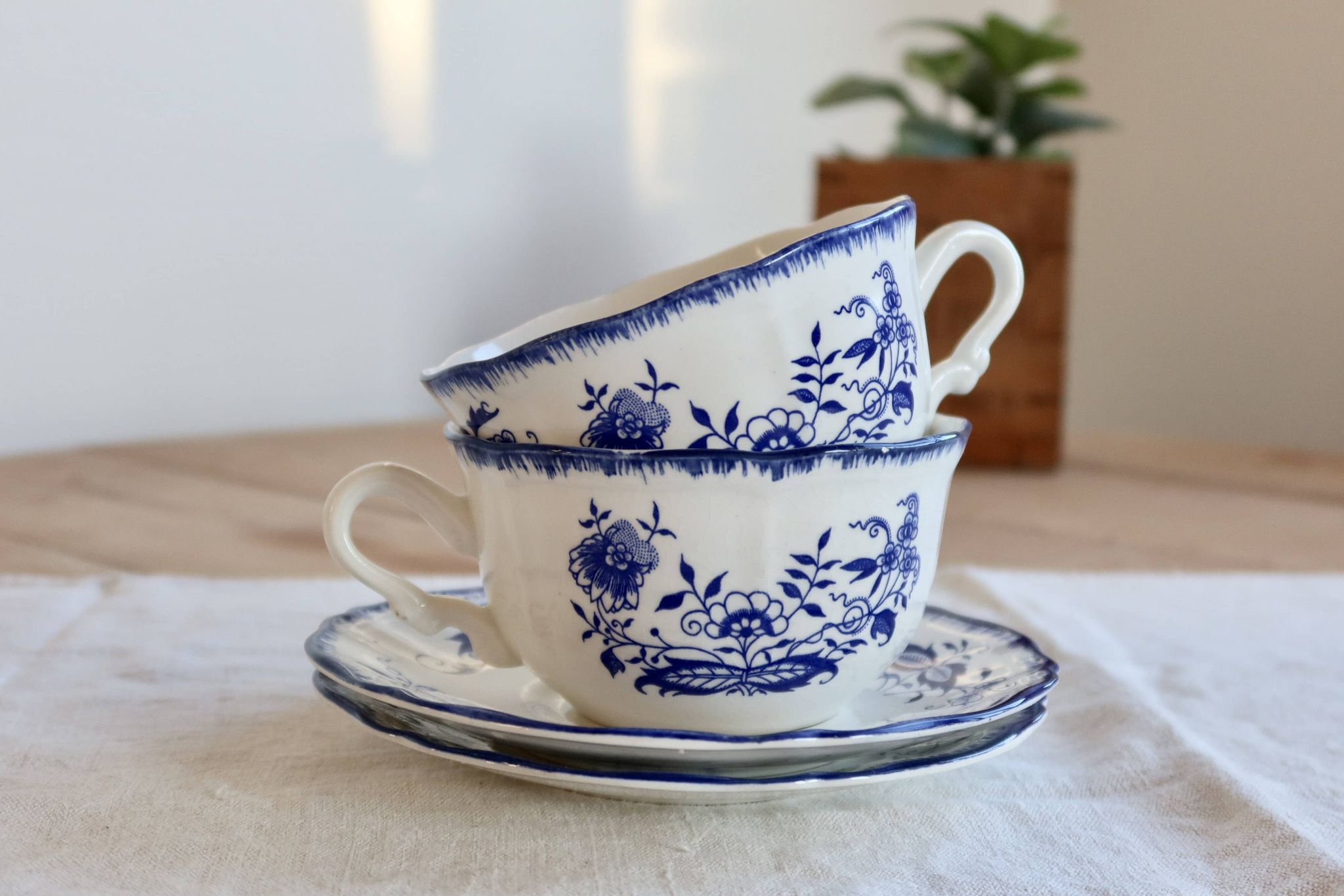 Old Lancaster cups and saucers in white earthenware with blue decoration.