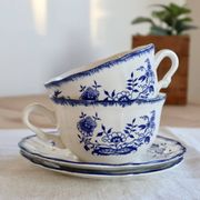 Old Lancaster cups and saucers in white earthenware with blue decoration.
