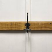 Antique wooden coat rack with metal hooks