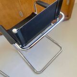 Pair of vintage chrome and black faux leather armchairs