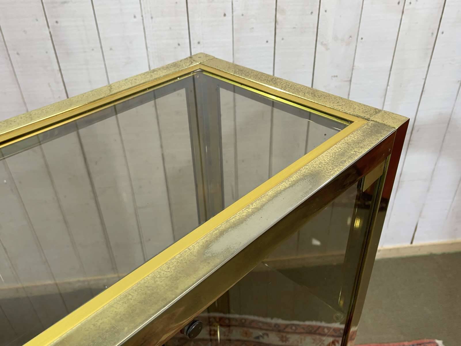 Exhibition showcase in gold-plated chrome and smoked glass - work from the 1980s.