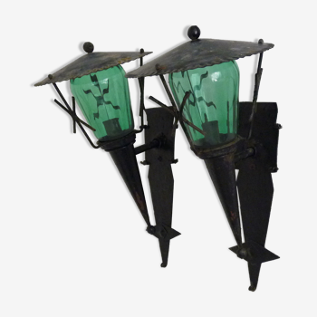 Pair of torch wall lamps, wrought iron lanterns and green glass. Exterior interior. Year 70
