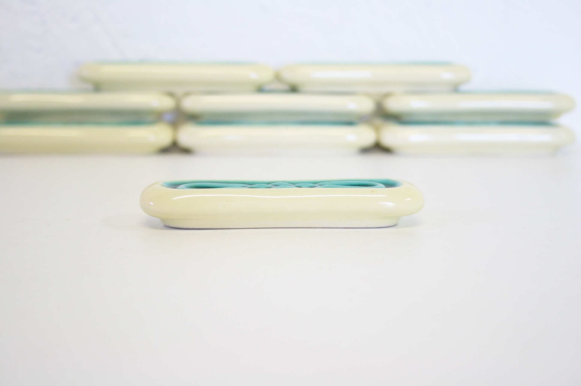 Set of twelve turquoise ceramic knife holders