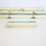 Set of twelve turquoise ceramic knife holders