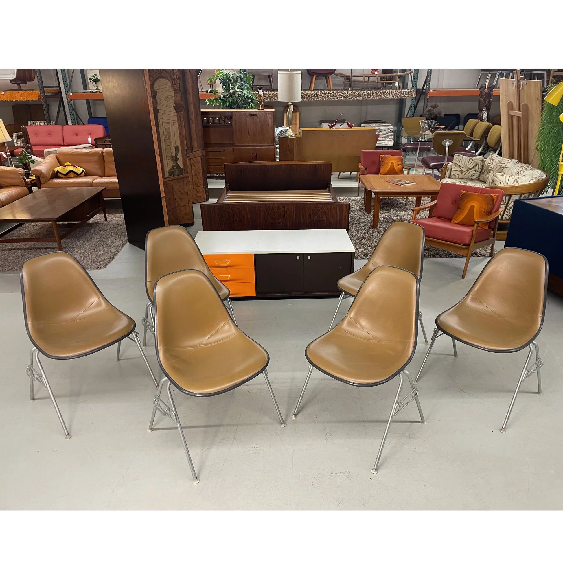 6 Herman Miller Eames stacking shell chairs with brown naugahyde pads