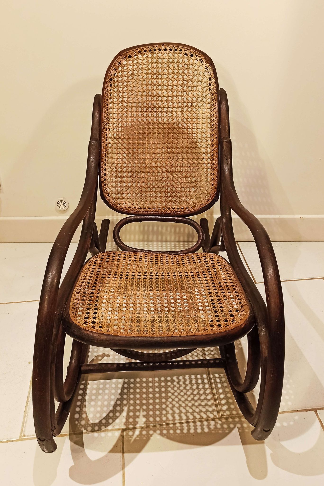 Vintage rocking chair for children in dark rattan and canework, rocking chair