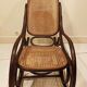Vintage rocking chair for children in dark rattan and canework, rocking chair