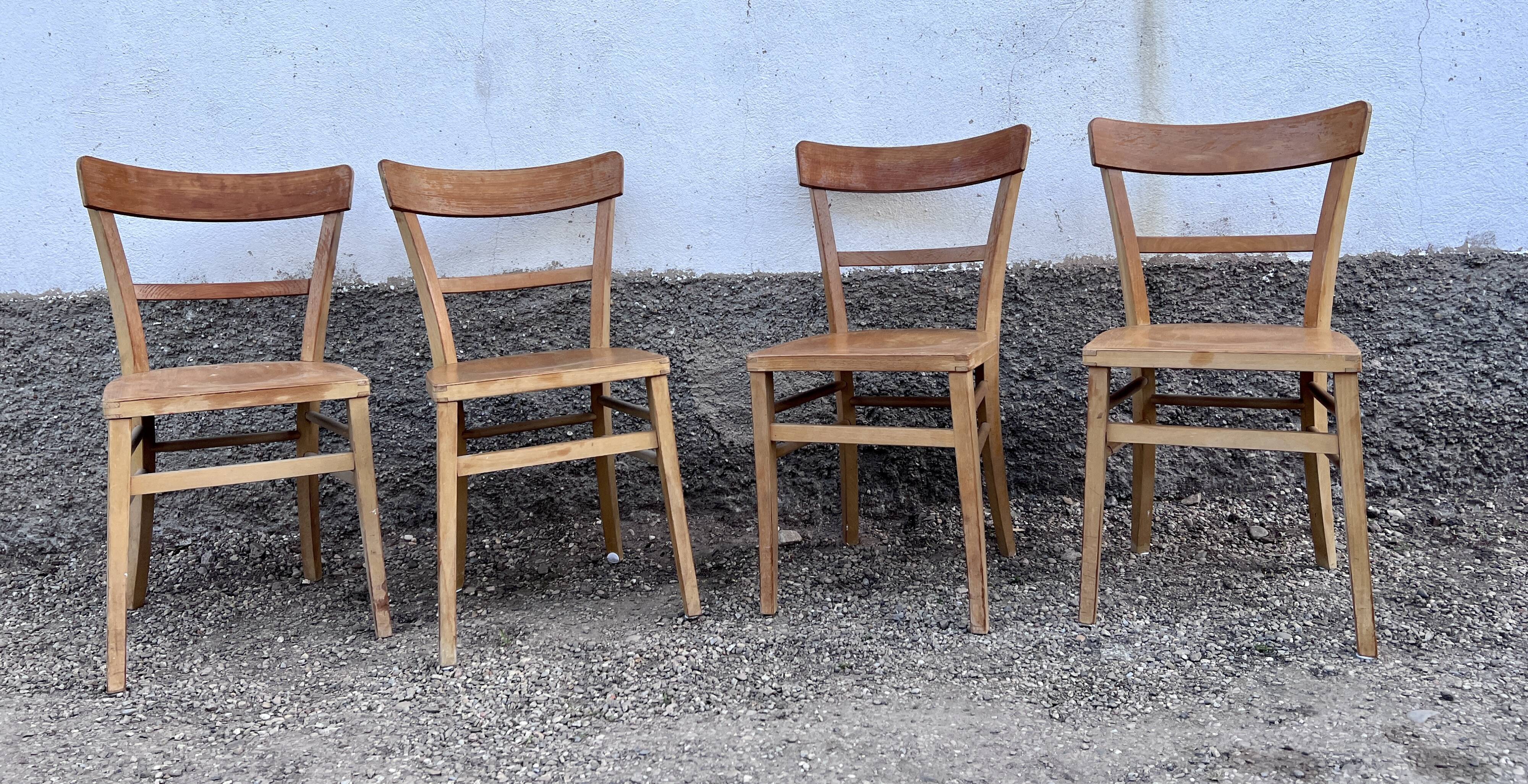 Series of 4 chairs in vintage light wood beech
