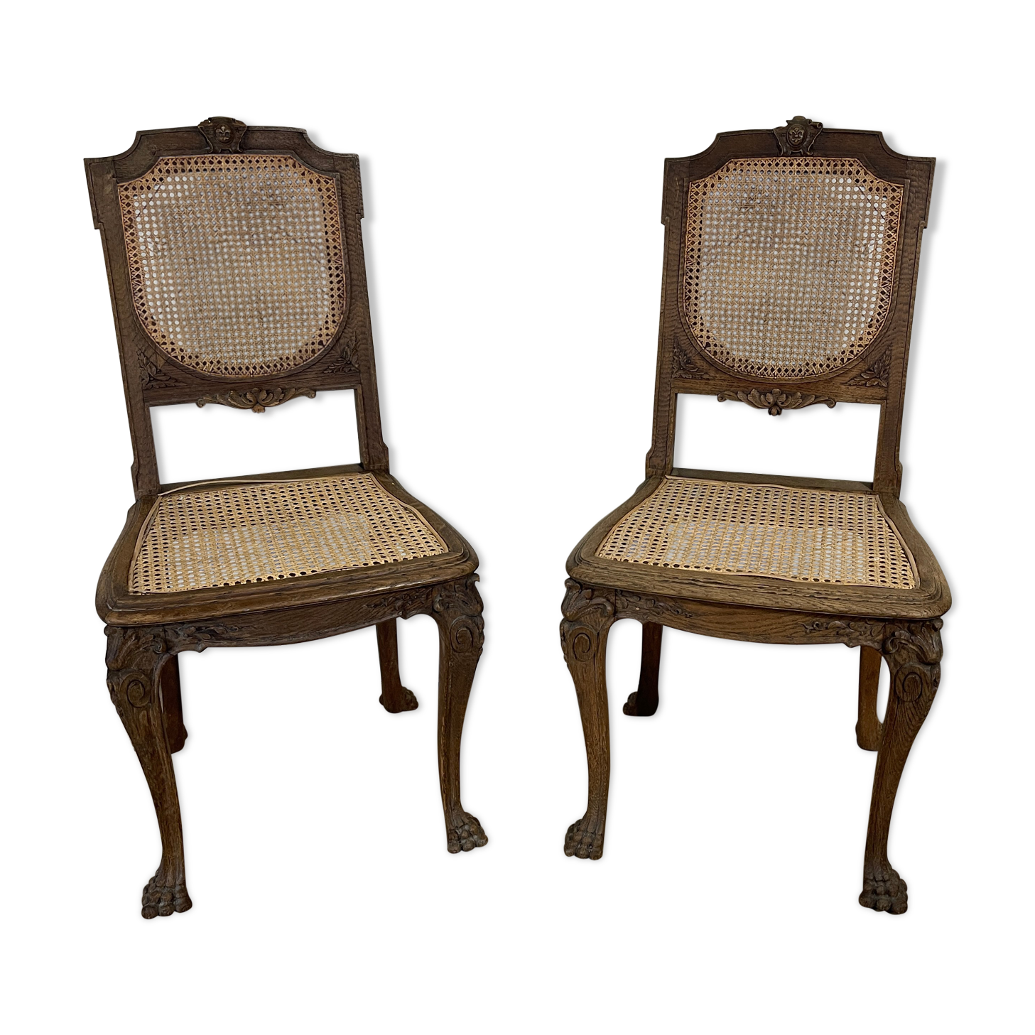 Paire de chaises cannée pieds pattes de lion