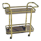Golden metal and glass rolling dessert trolley