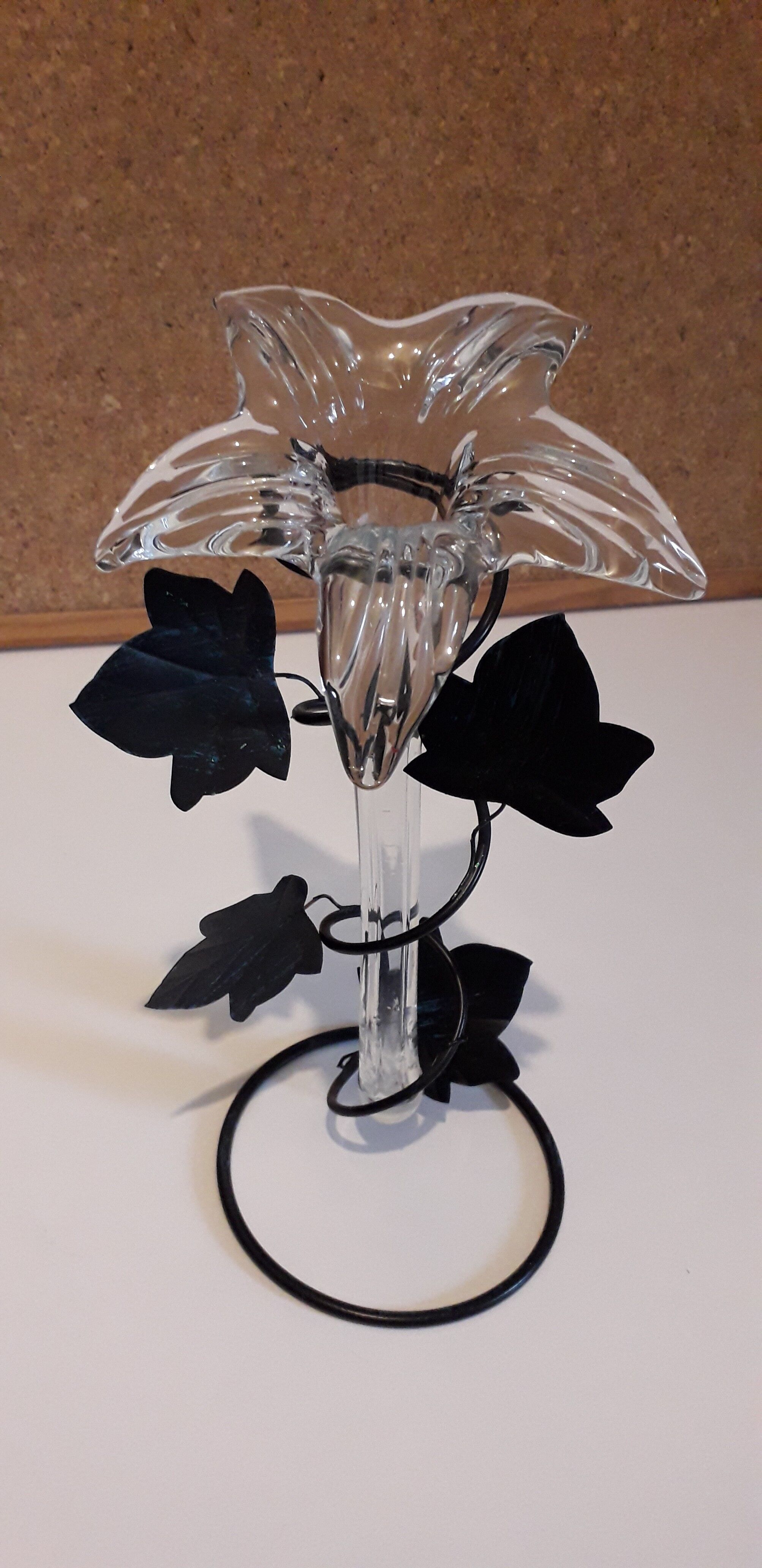 Glass soliflore vase in the shape of a fleur-de-lis on metal base