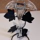 Glass soliflore vase in the shape of a fleur-de-lis on metal base
