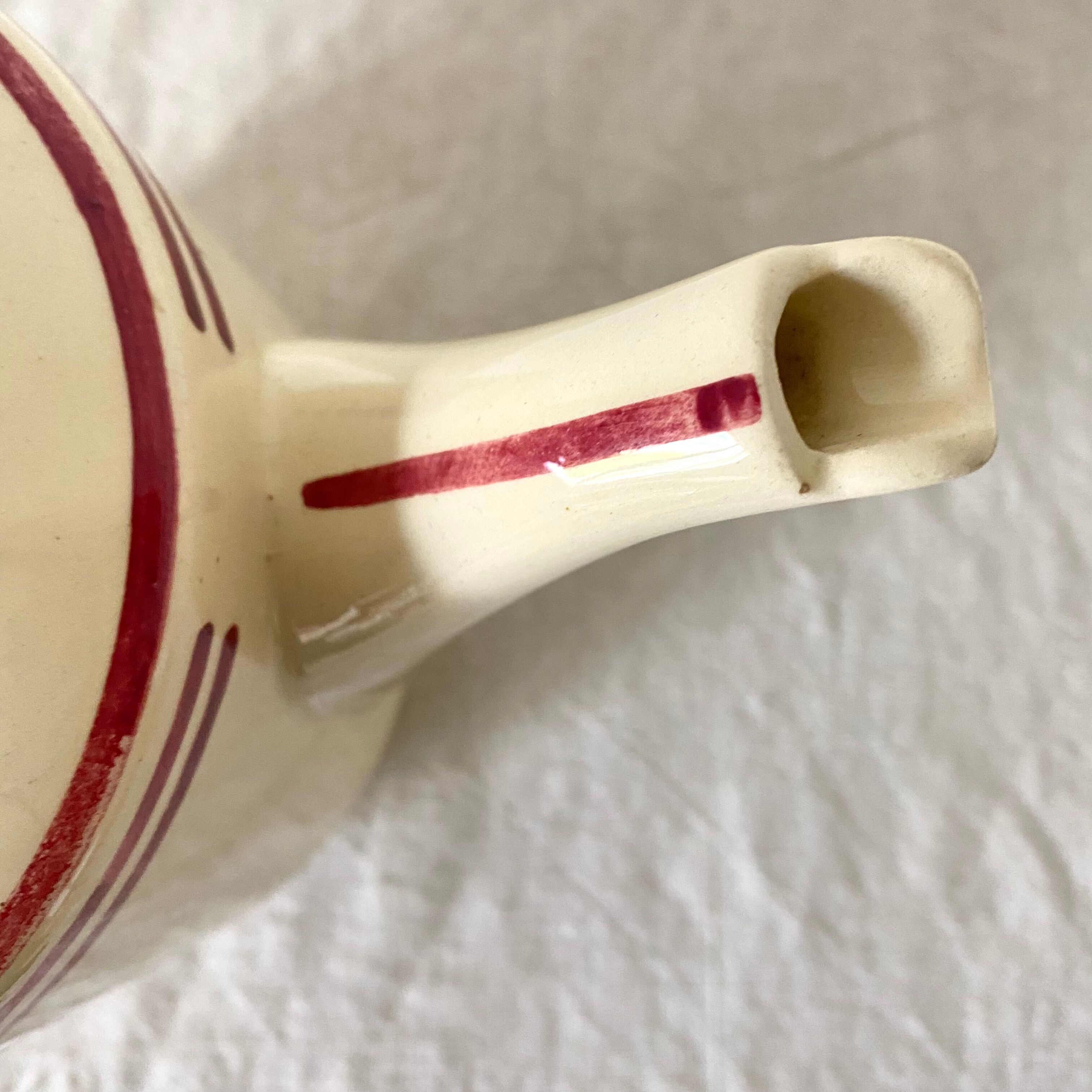 Old teapot in Gien earthenware