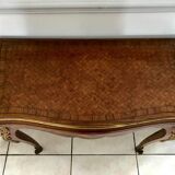 Console transforming into a 19th century Louis XV style gaming table