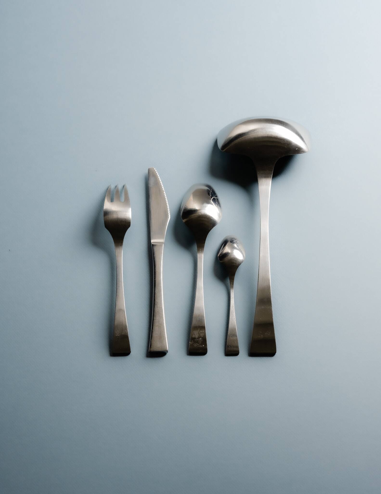 GUY DEGRENNE STAINLESS STEEL CUTLERY SET, 1970s