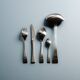 GUY DEGRENNE STAINLESS STEEL CUTLERY SET, 1970s
